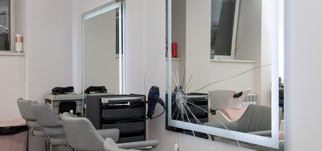 Workplace for haircut in barbershop, with backlit mirror