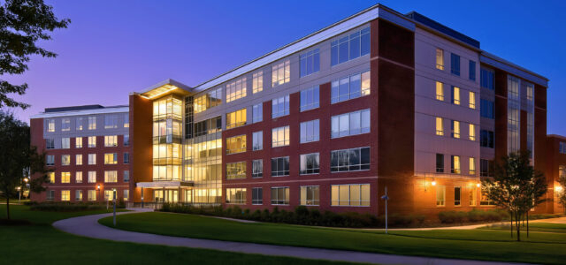 Multi story school dorm building exterior, modern university cam