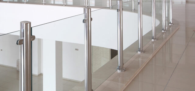 Modern glass elevator and glass railings