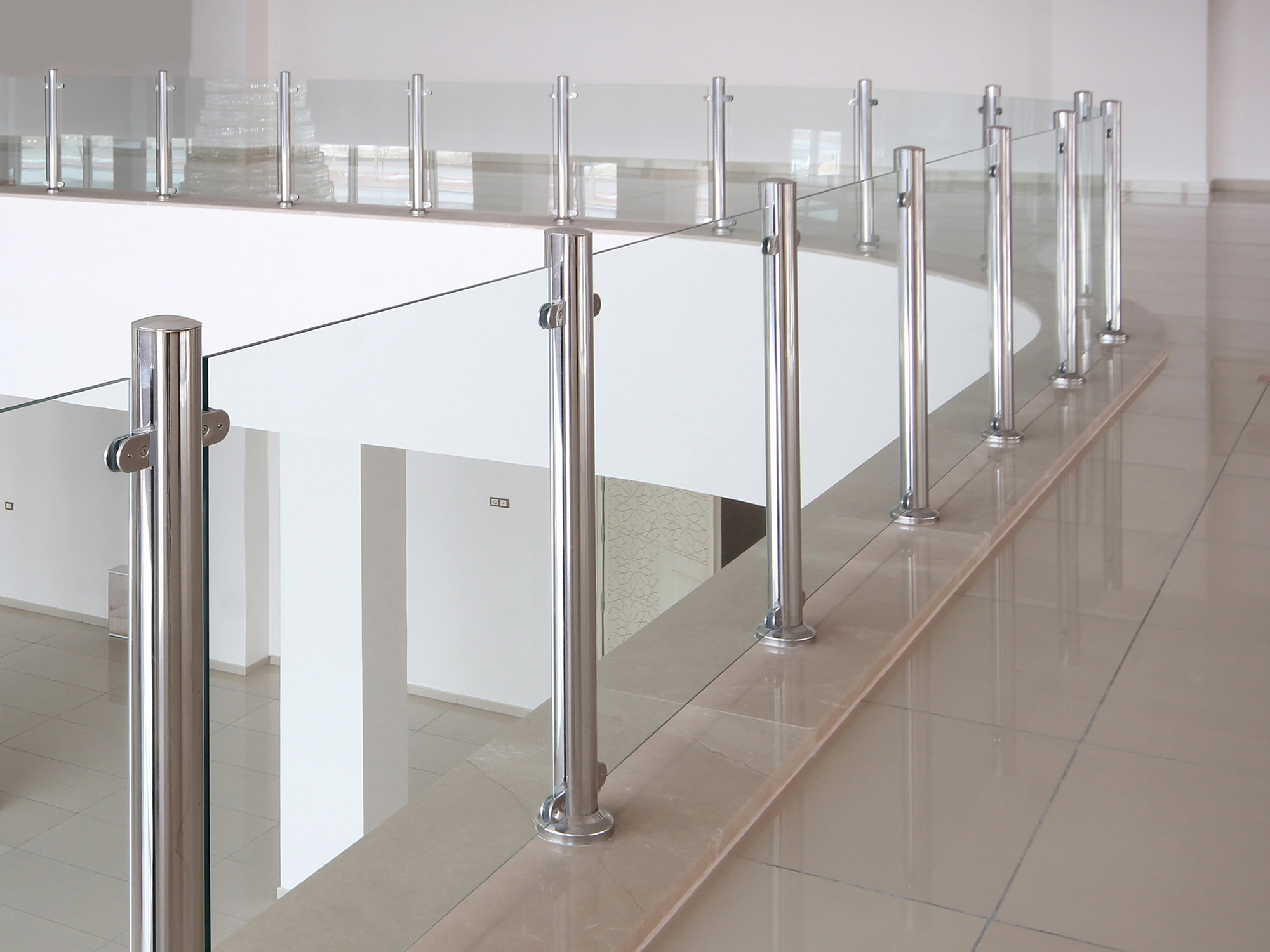 Modern glass elevator and glass railings