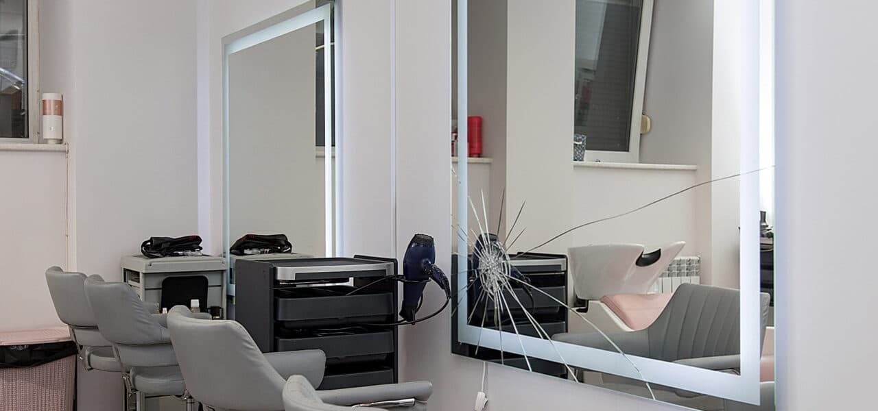 Workplace for haircut in barbershop, with backlit mirror