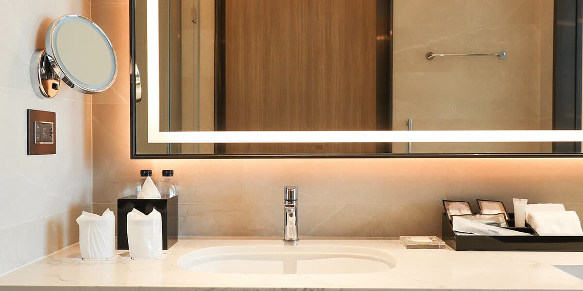 Luxury bathroom marble counter top with faucet, sink , mirror an